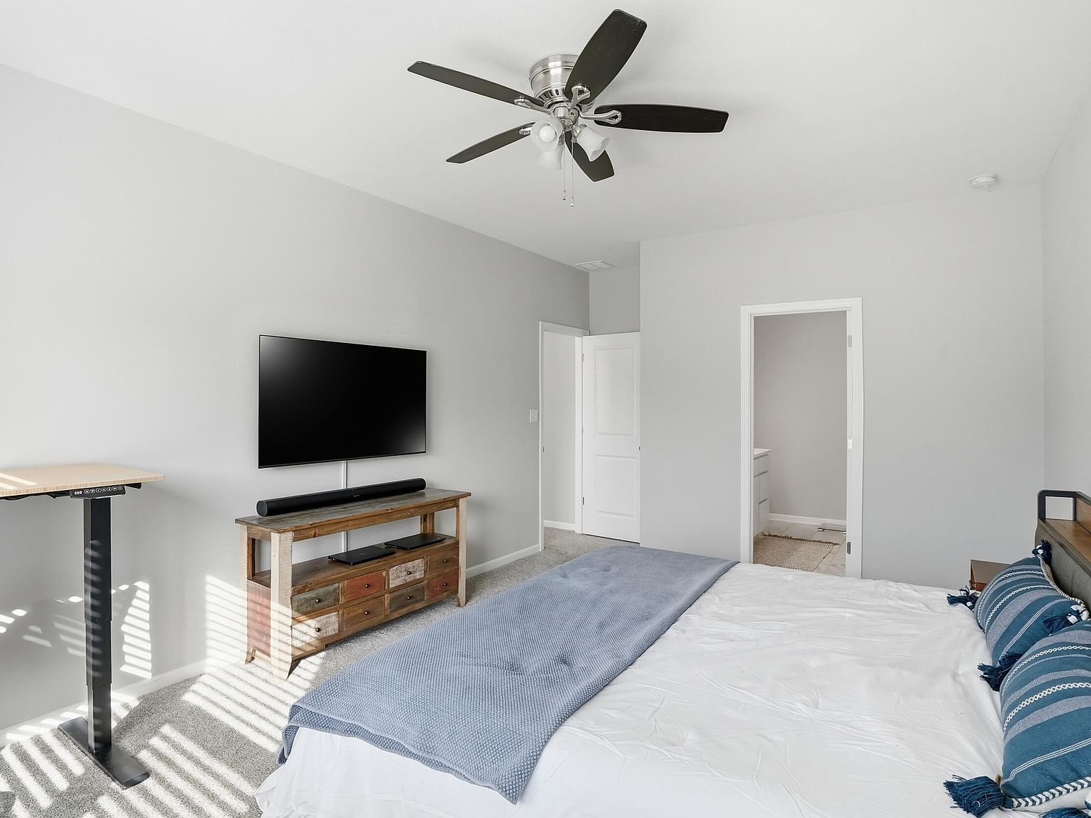 Primary bedroom with natural light from side windows