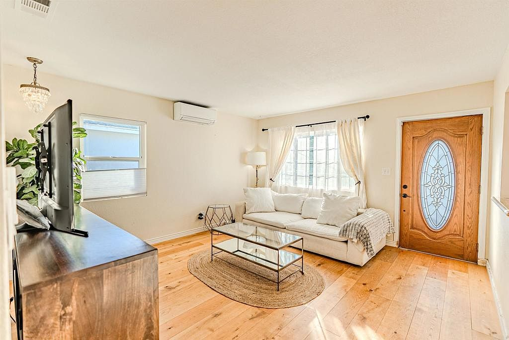 Living room with hardwood floors and natural light