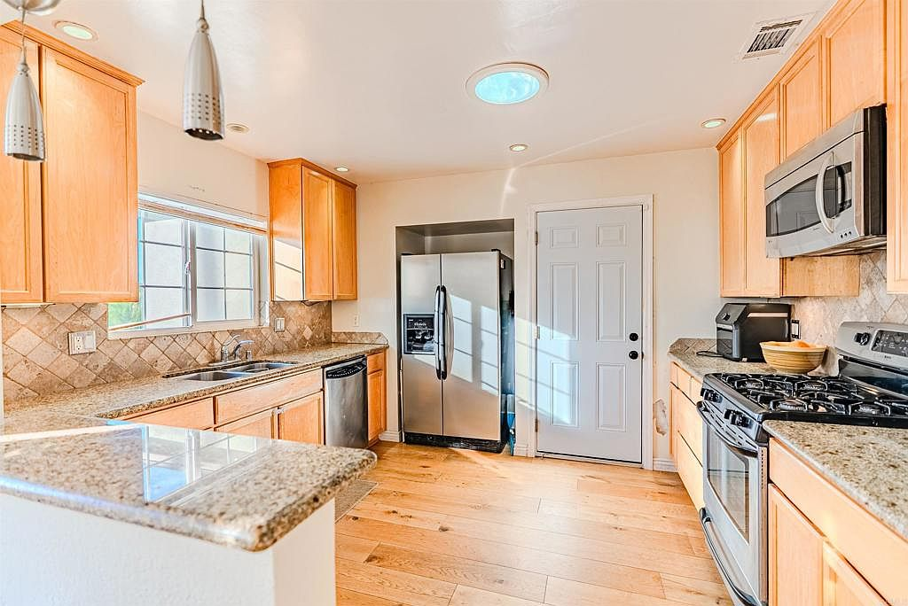 Kitchen with granite countertops and updated cabinetry