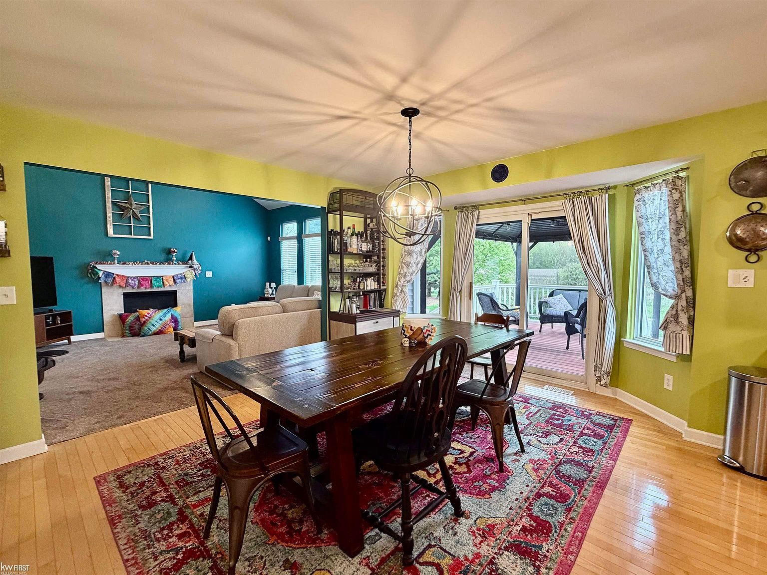 Dining area with view to backyard deck through sliding glass doors