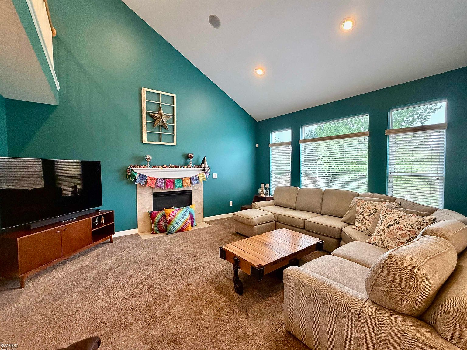 Vaulted great room with gas fireplace and wall of windows