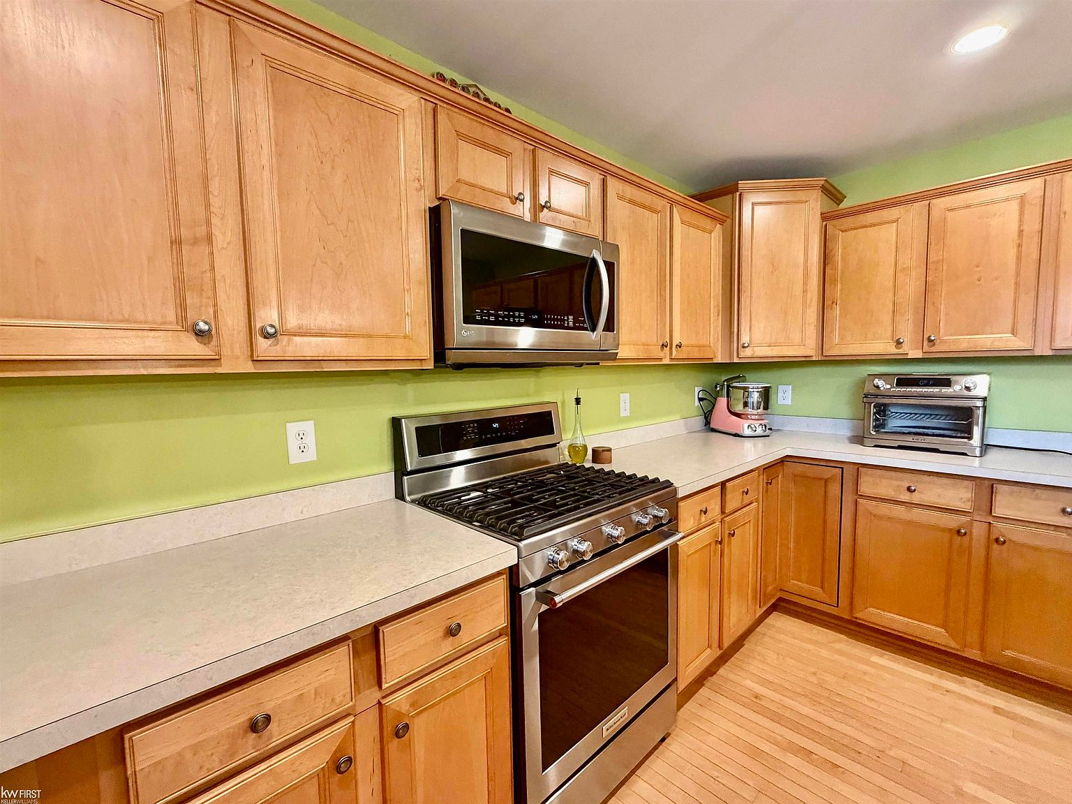 Kitchen showing stainless steel range and maple cabinets