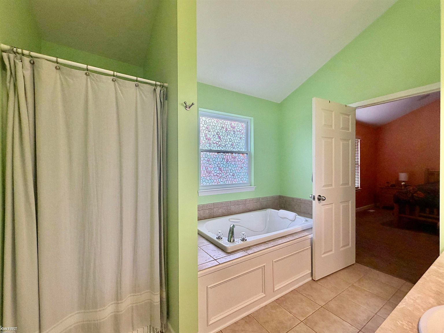 Primary bathroom with jetted soaking tub and separate shower