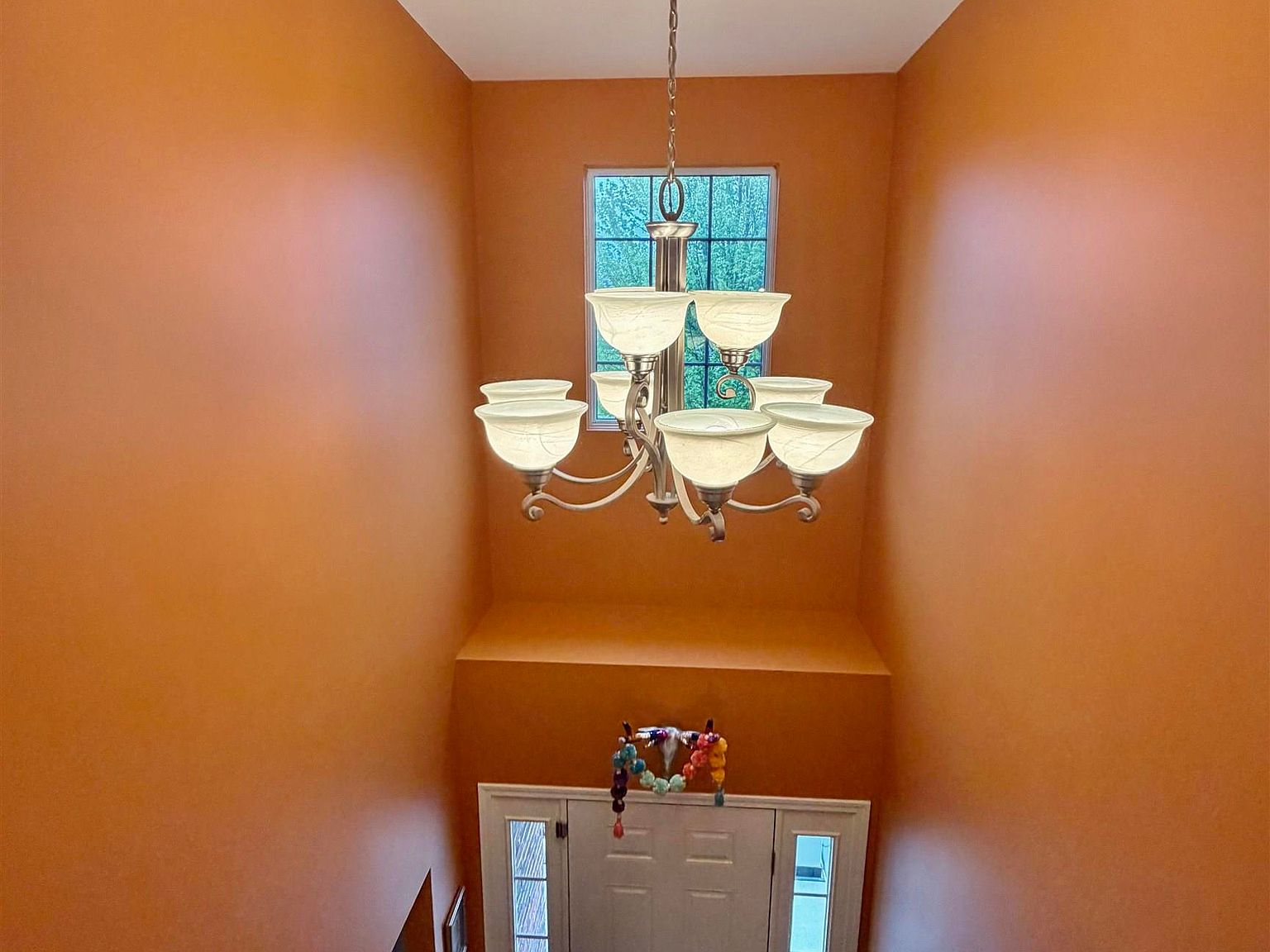 Foyer from above with chandelier and tall window