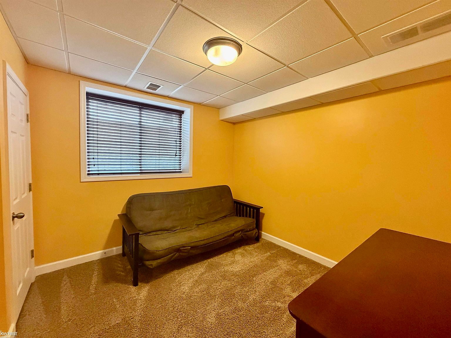 Basement bedroom with egress window