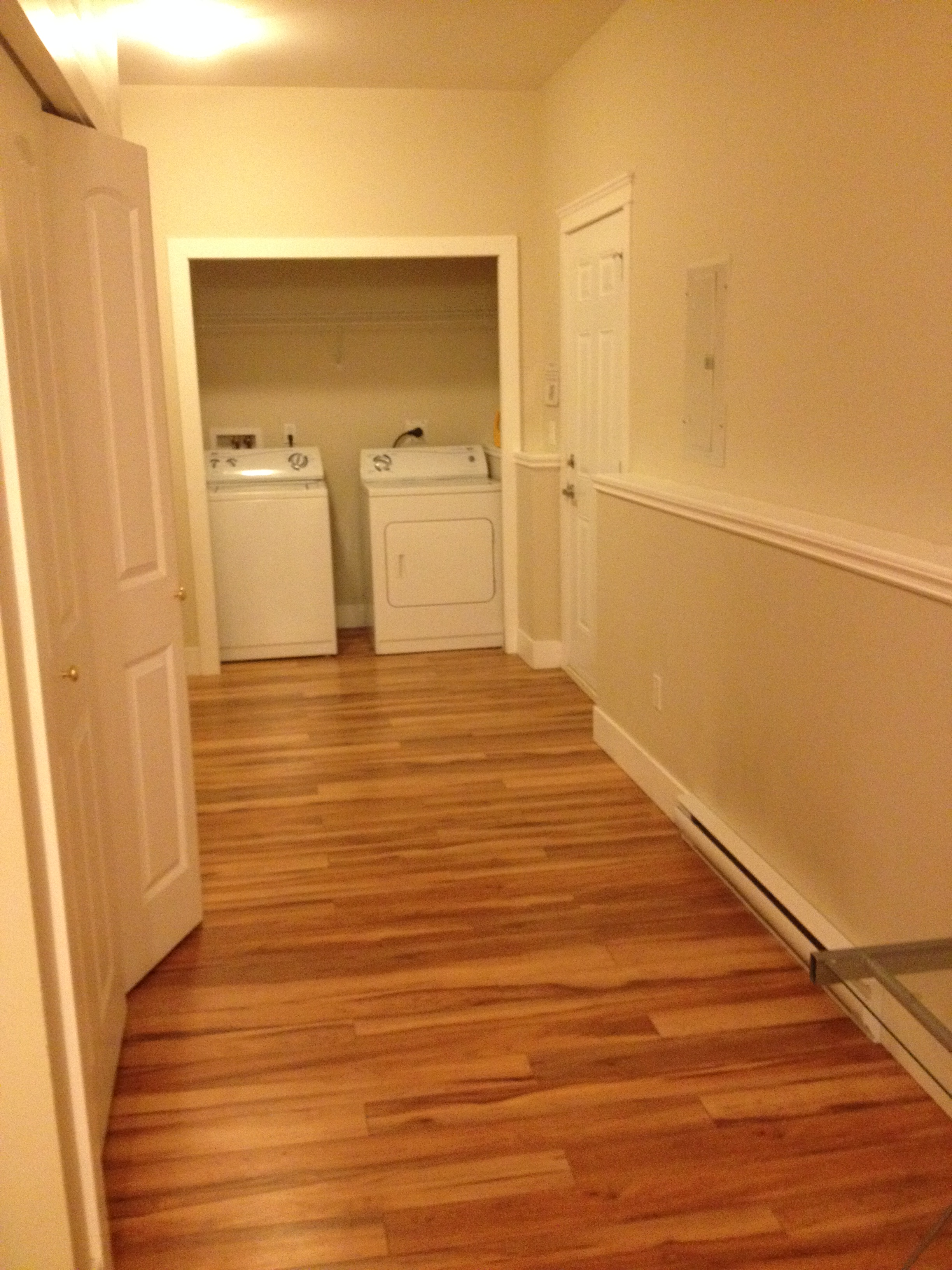 Laundry area with standalone washing machine and recessed dryer