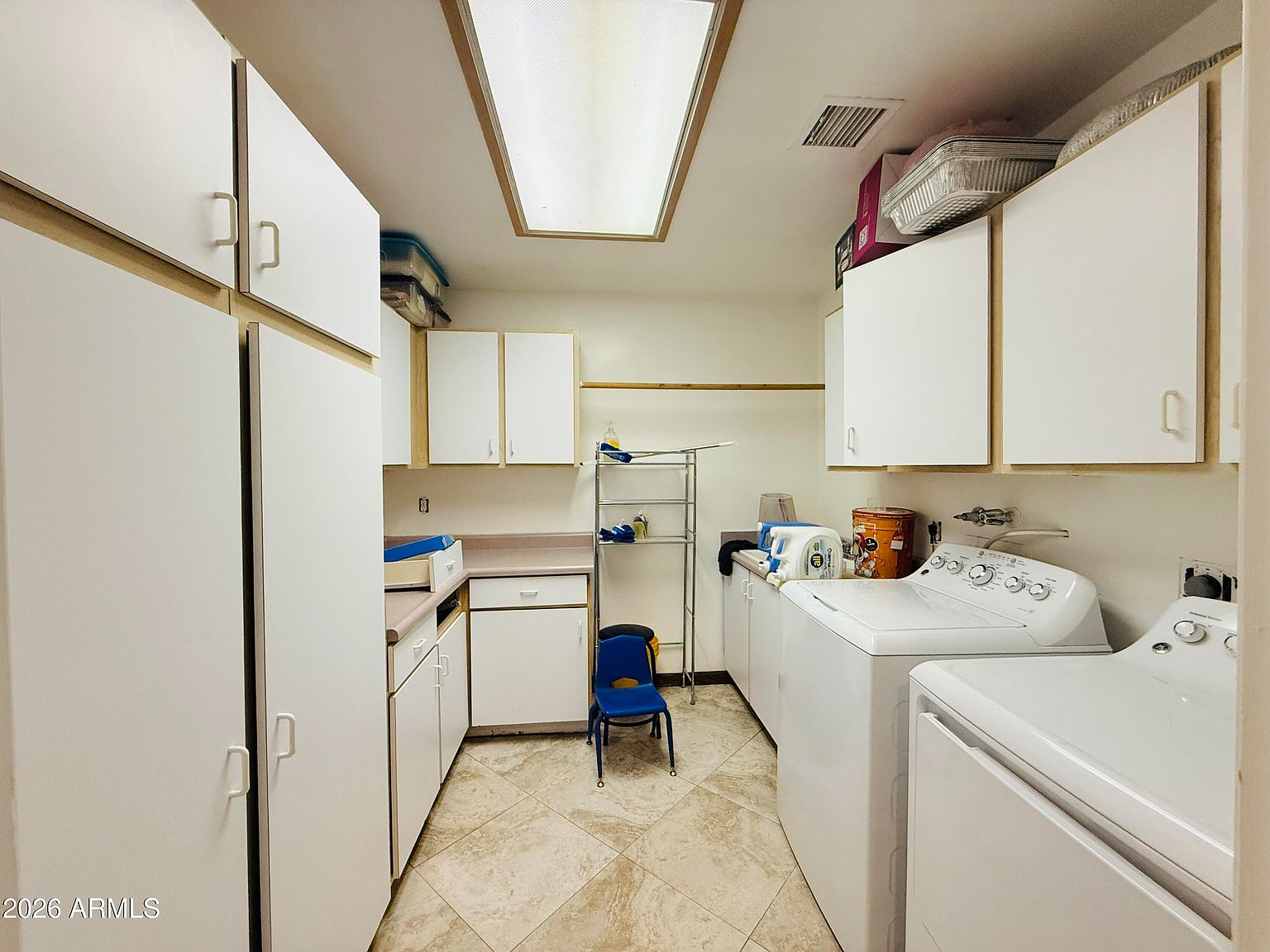 Utility laundry room with washer and dryer
