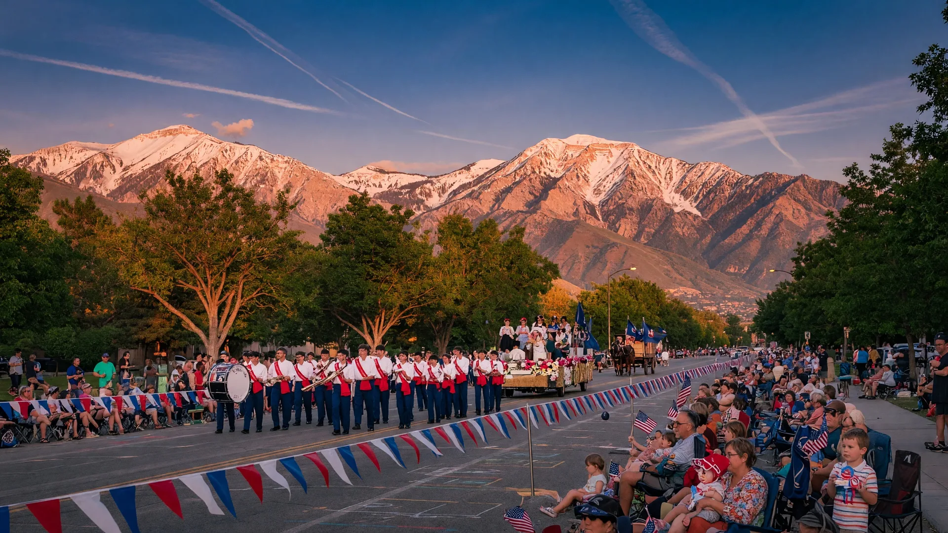 Pioneer Day parade along the Wasatch Front with mountains in the background