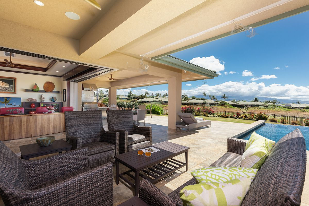 Comfortable covered lanai lounge looking out toward the backyard and golf course.