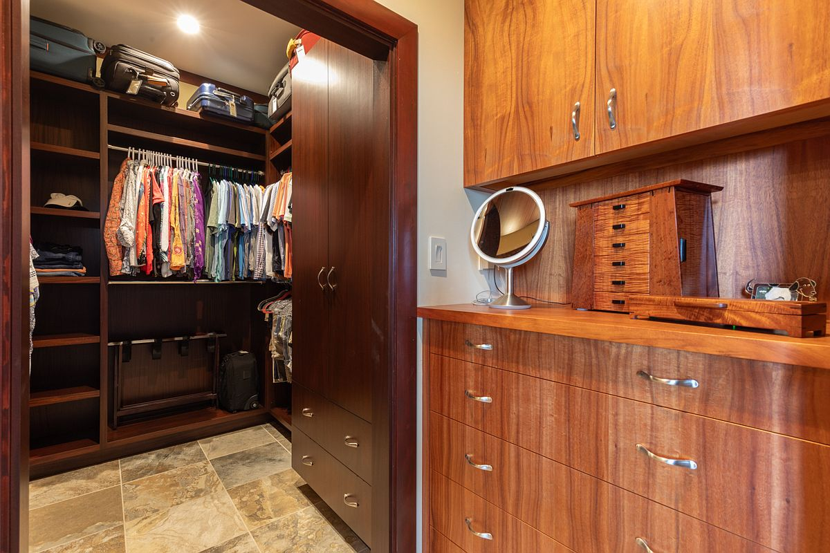 Spacious custom master closet and dressing room.