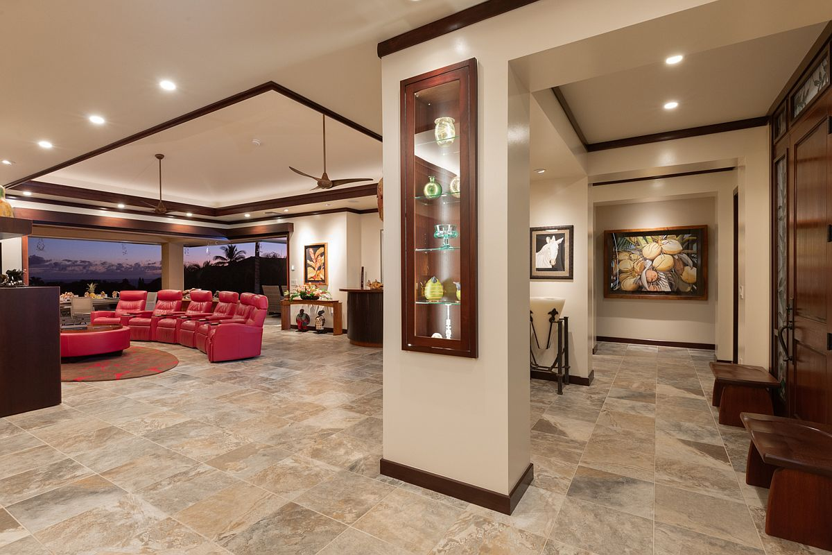 Entrance foyer looking into the high-ceilinged open-concept living area.