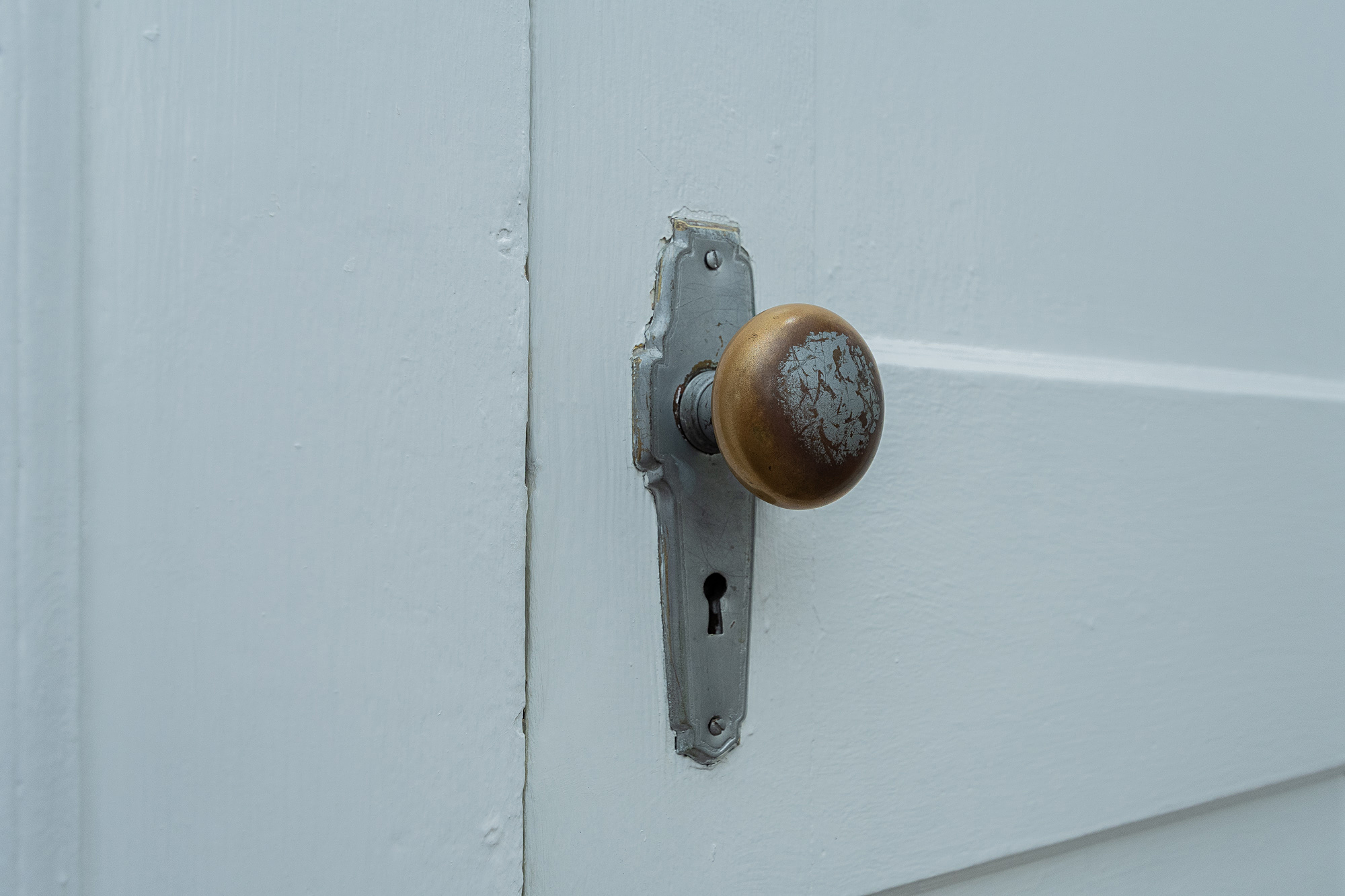 Stunning close-up view of a classic wooden vintage doorknob and lock faceplate