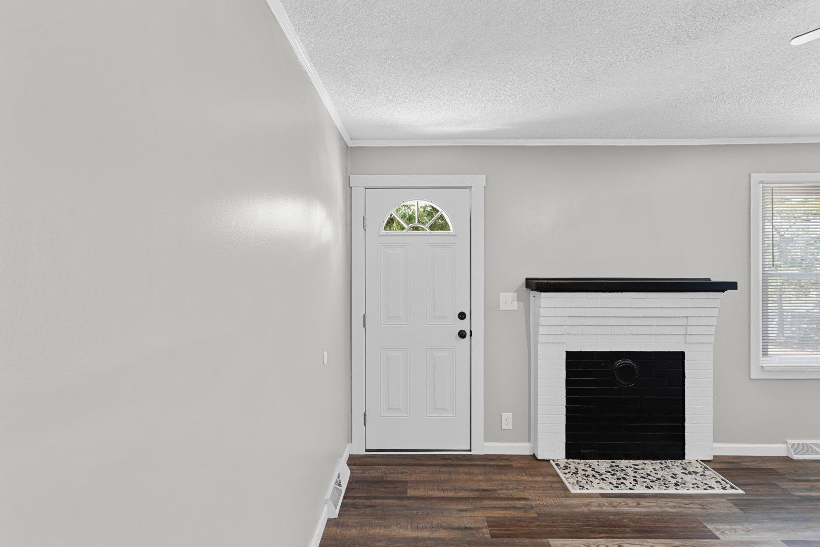 Bright interior living room with brand-new wood-look flooring and inviting layout