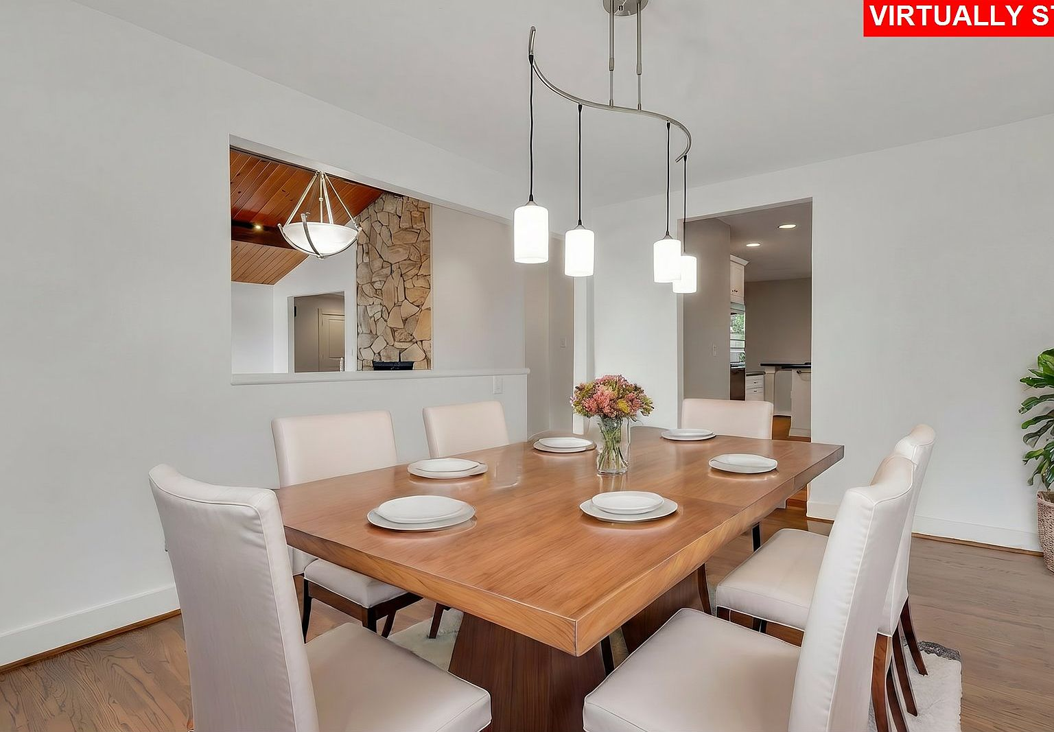 Dining room with wood table and modern pendant light