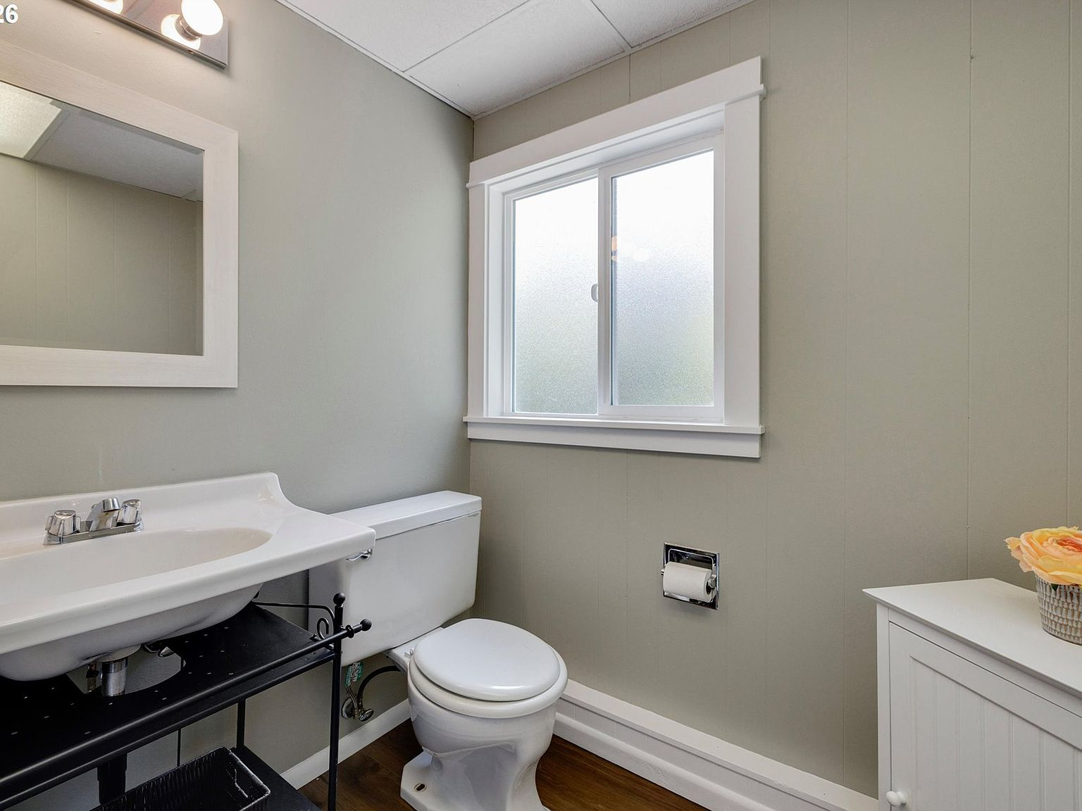 Powder room with vertical paneled walls