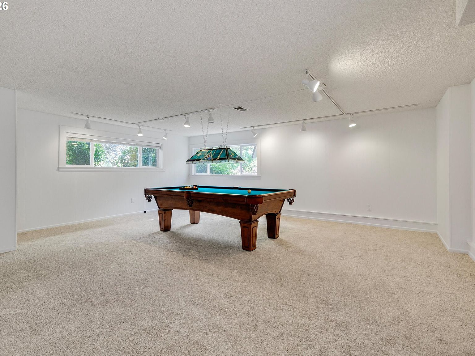 Basement recreation room with pool table