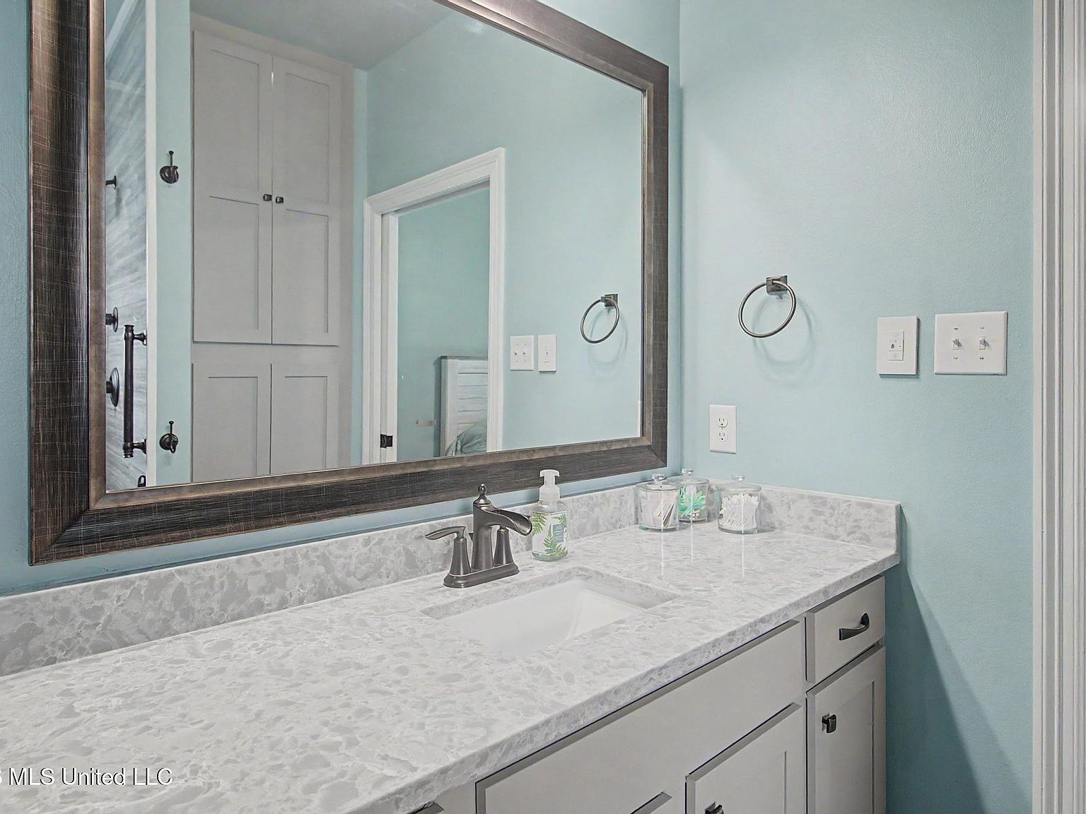 Primary bathroom vanity counter and mirror