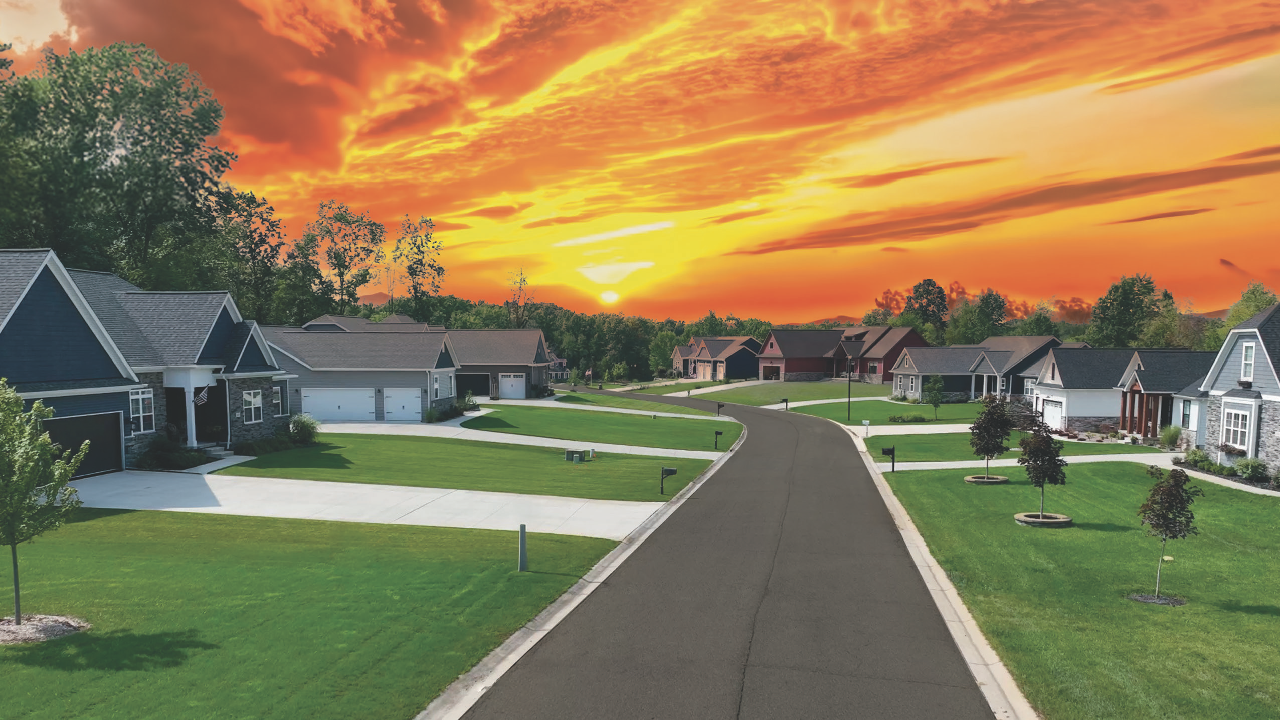 Aerial view of a modern suburban neighborhood in Grand Blanc Michigan under a dramatic sunset sky