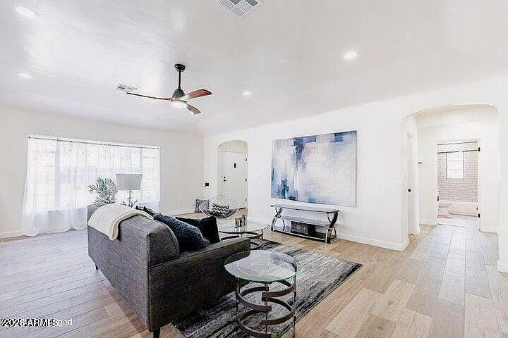 Spacious transitional style living room with neutral finishes