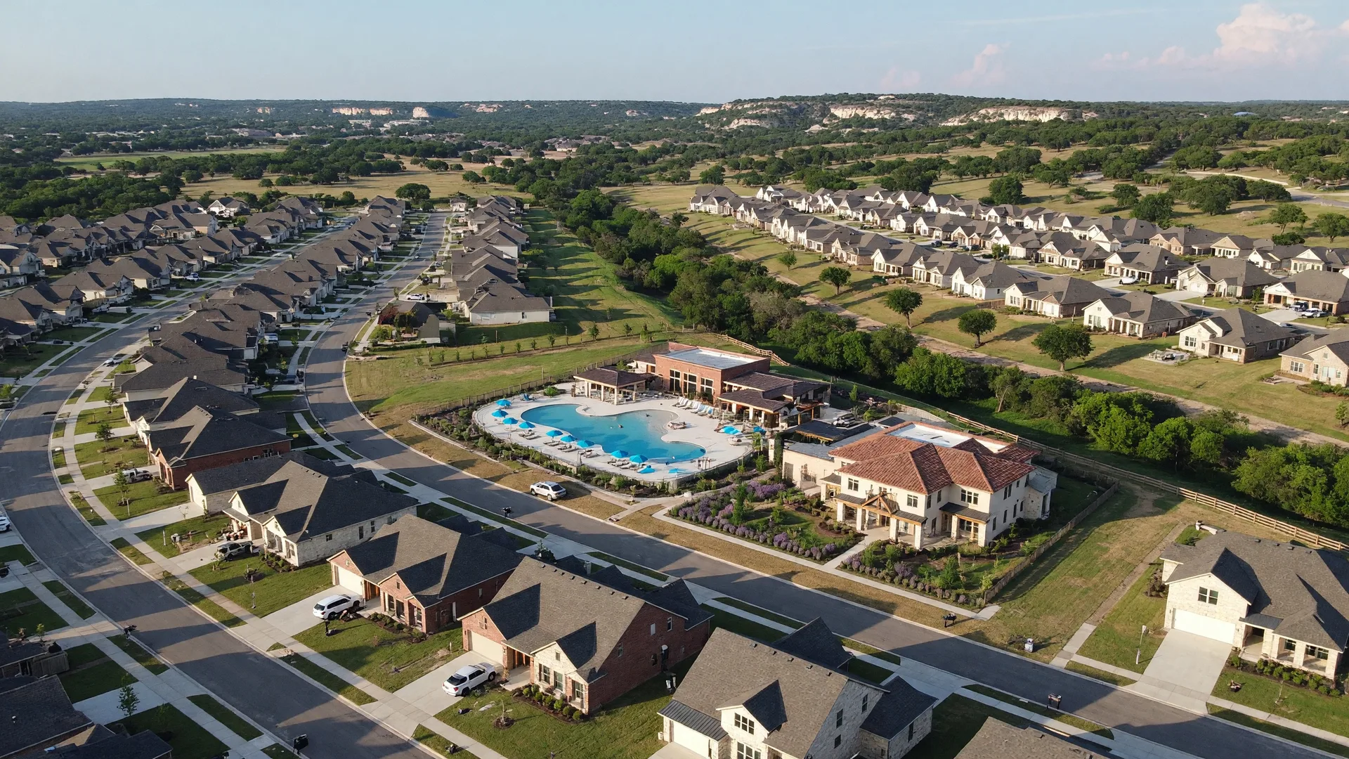Village Green gated community near Boerne, Texas — elegant custom homes surrounded by mature live oaks and Hill Country terrain