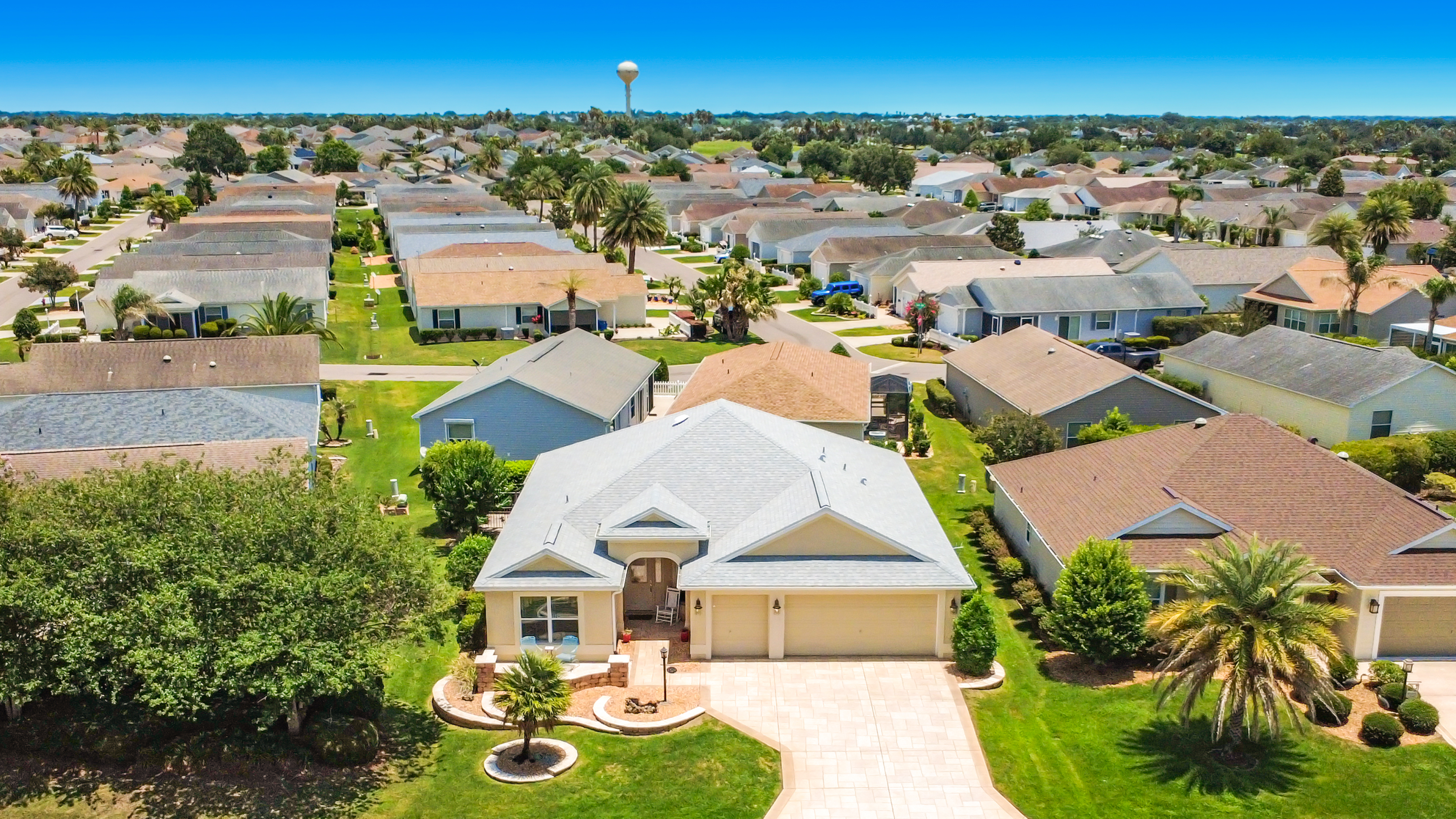 Aerial view of the property and surrounding neighborhood