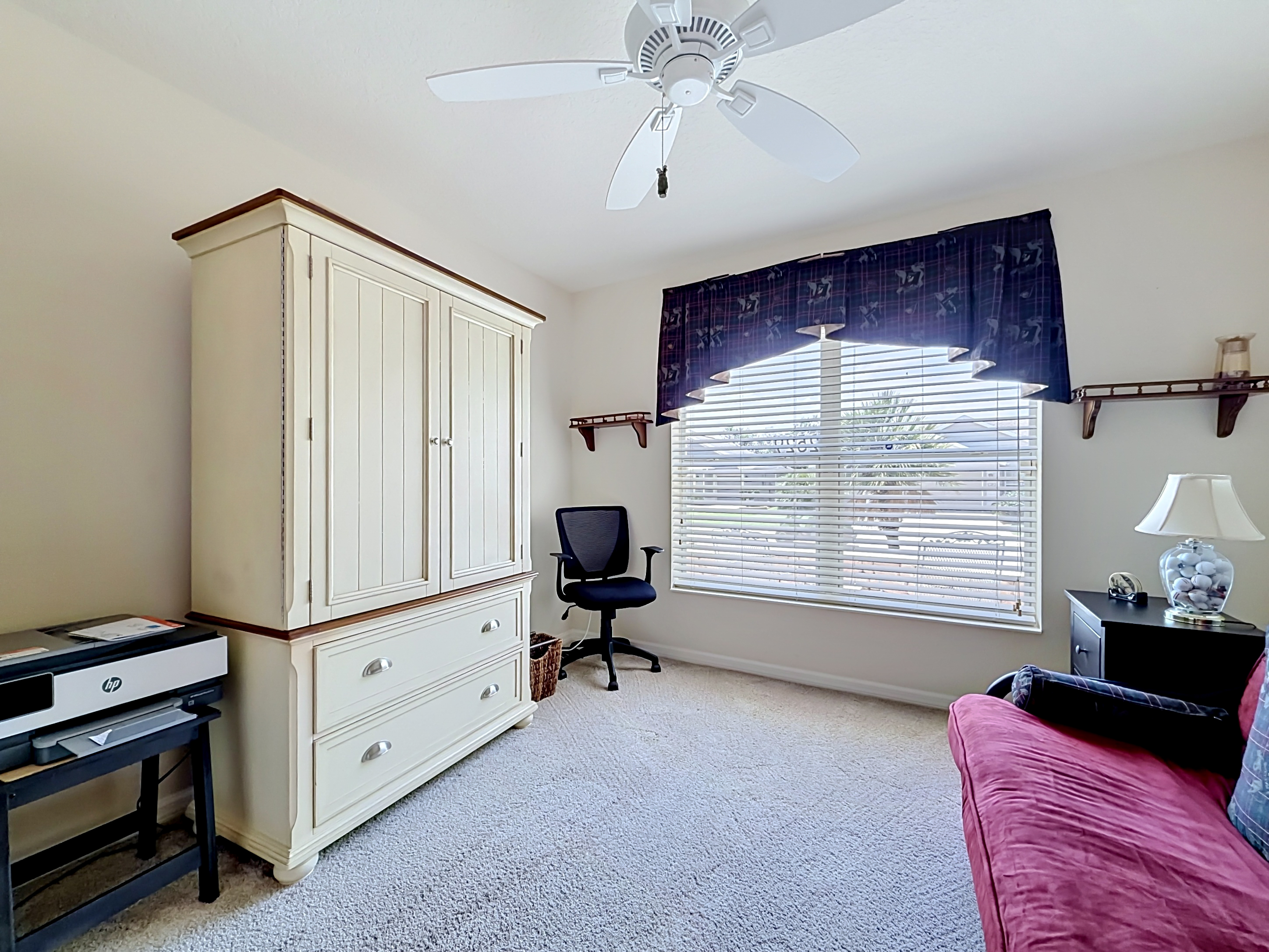 Secondary bedroom set up as a home office
