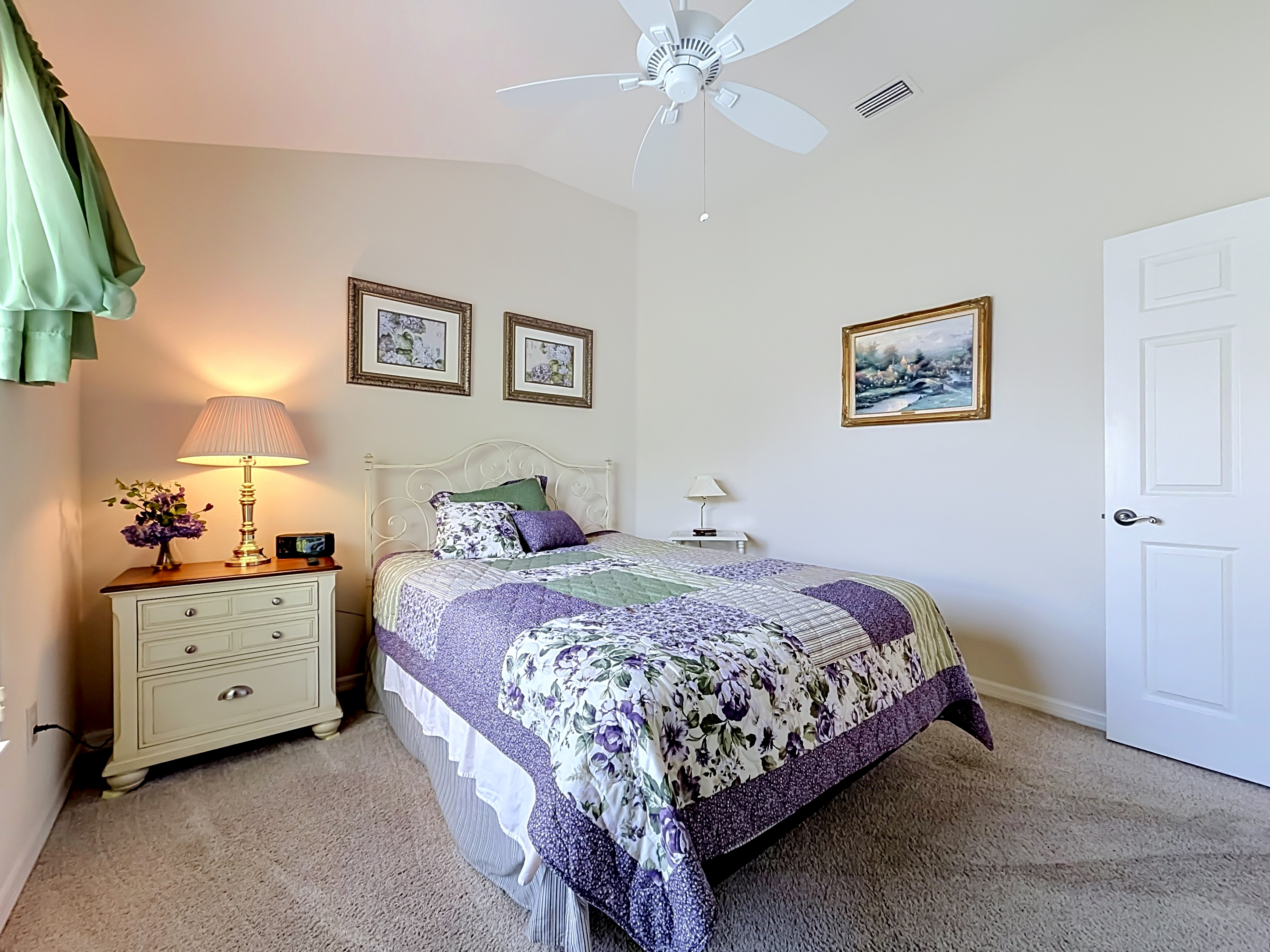 Guest bedroom with carpeted floors