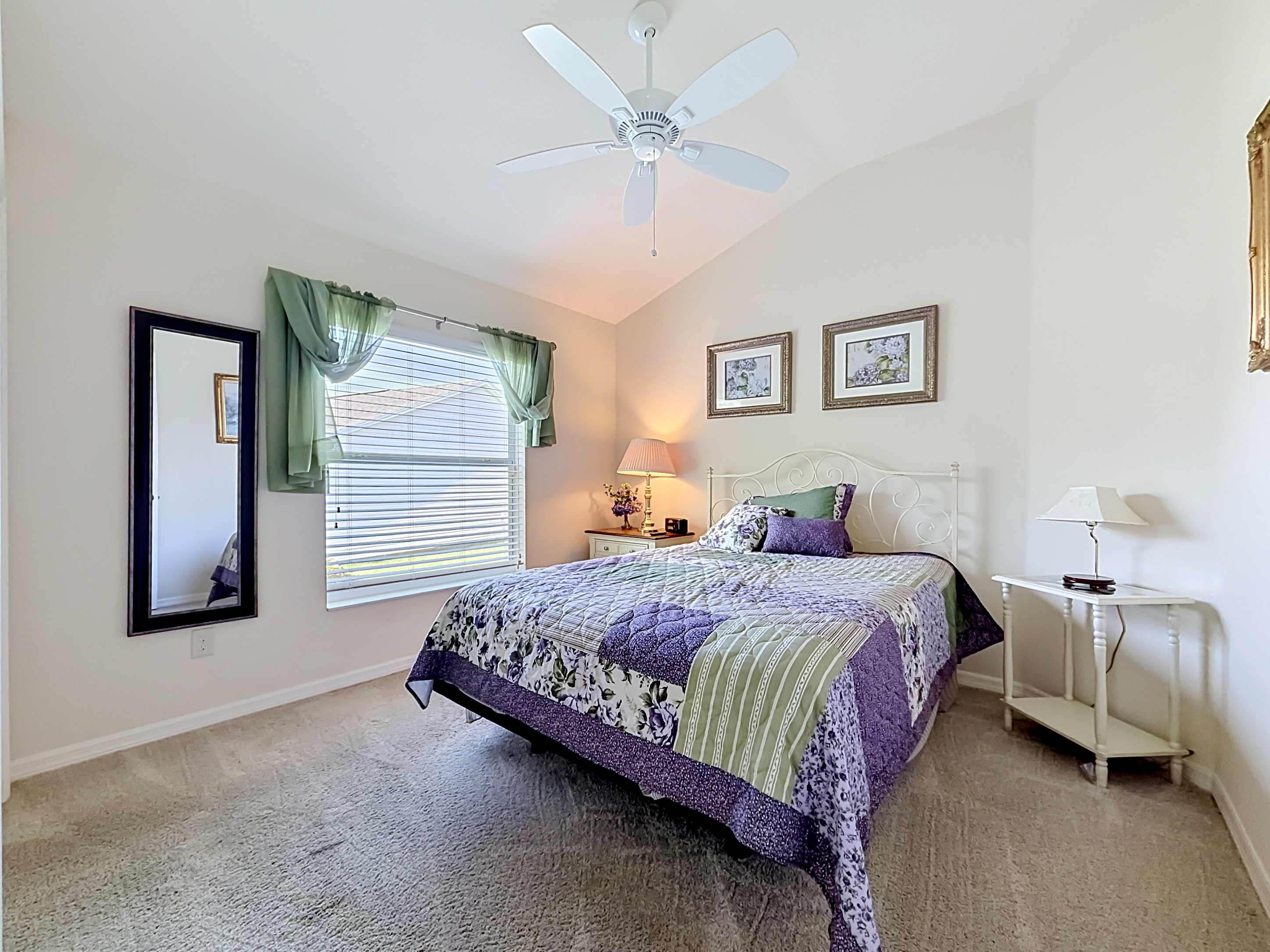 Master bedroom corner perspective with vaulted ceiling