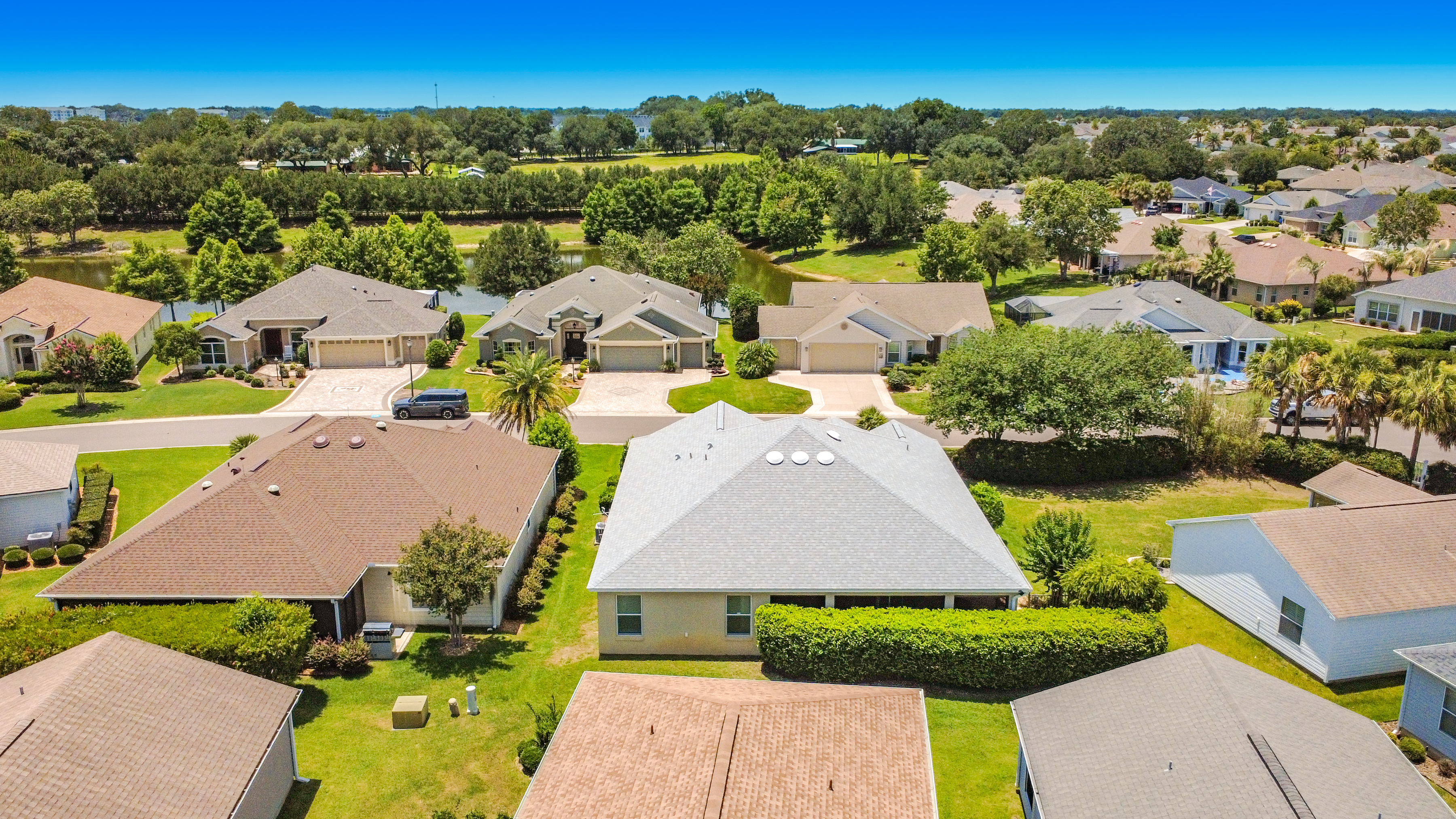 Aerial view of The Villages neighborhood with retention pond