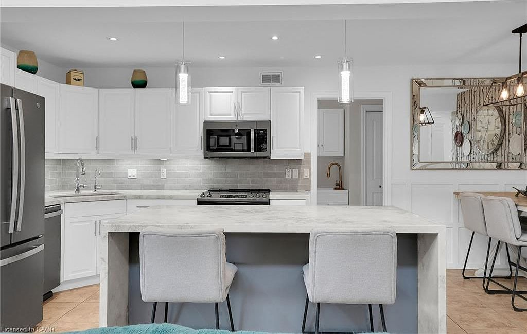 Modern kitchen with waterfall island at 31 Townsend Dr