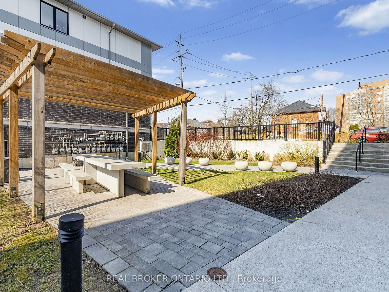 Private backyard patio with pergola at 630 Rogers Road Unit 21
