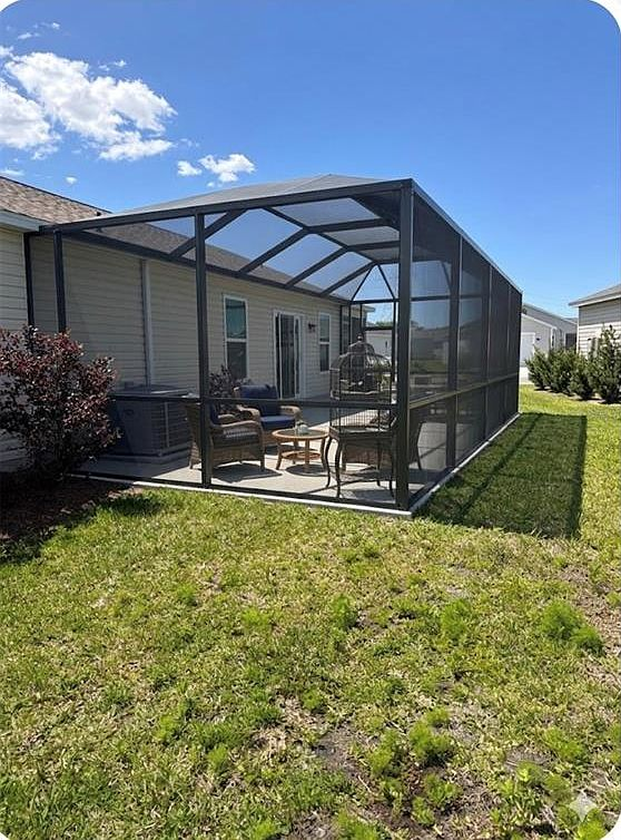 Screened lanai with outdoor seating area for year-round Florida outdoor living