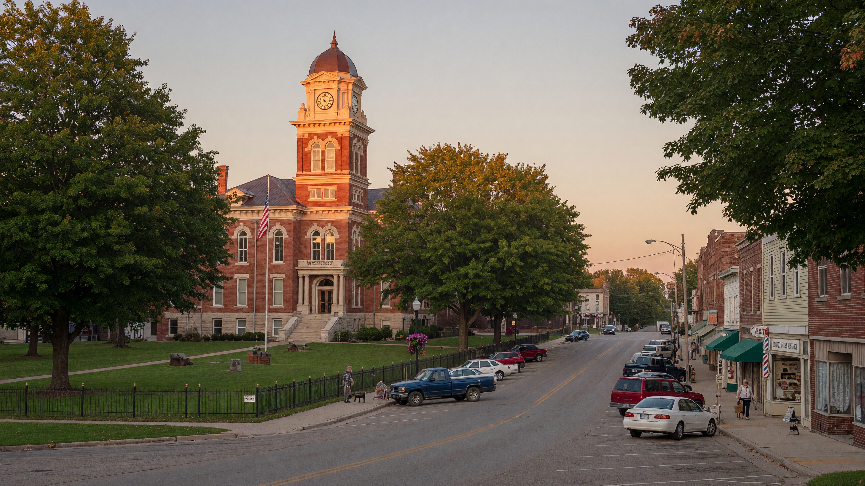 Historic downtown Owosso, Michigan with charming storefronts and tree-lined streets