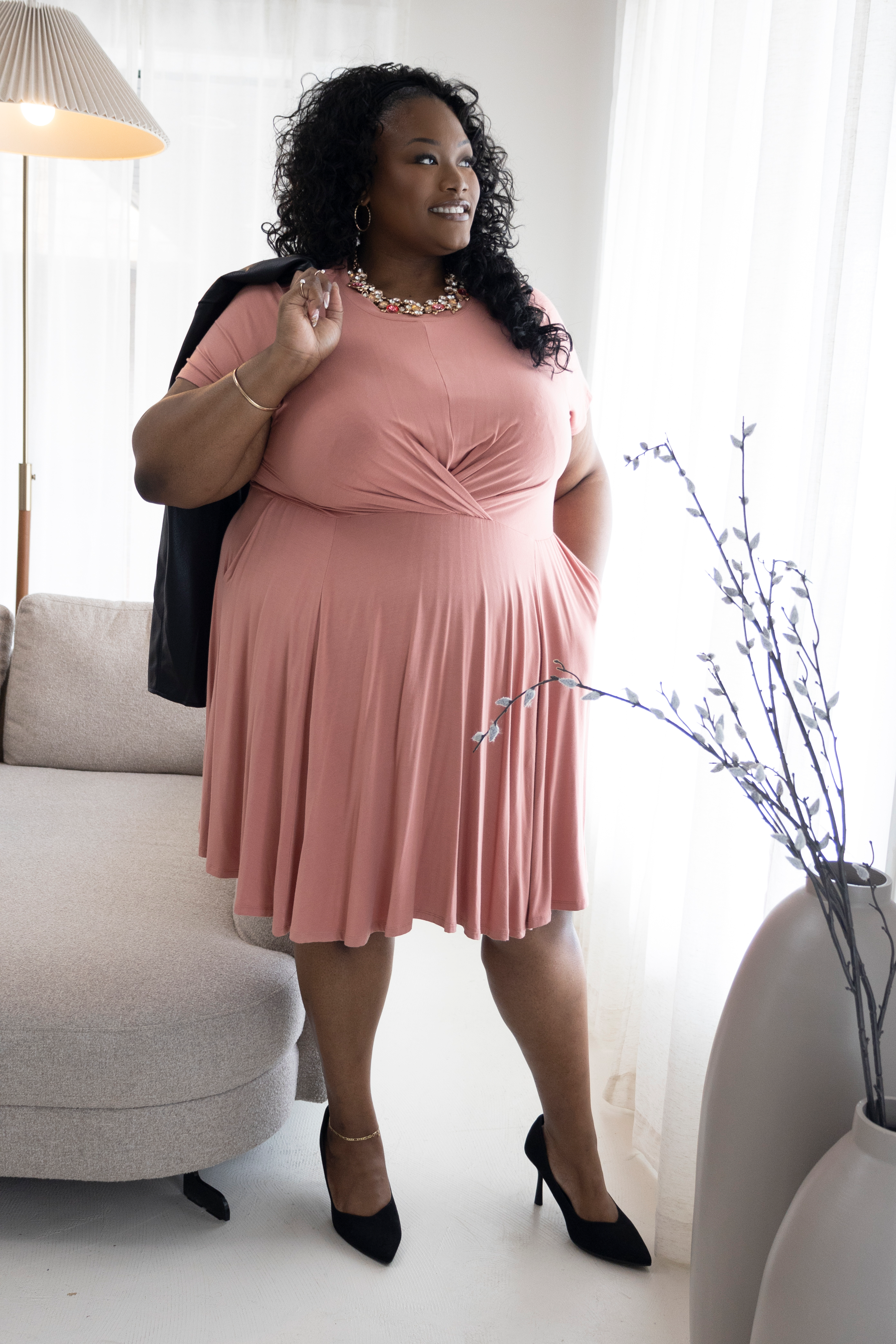 Tory Akene full body portrait in a pink dress