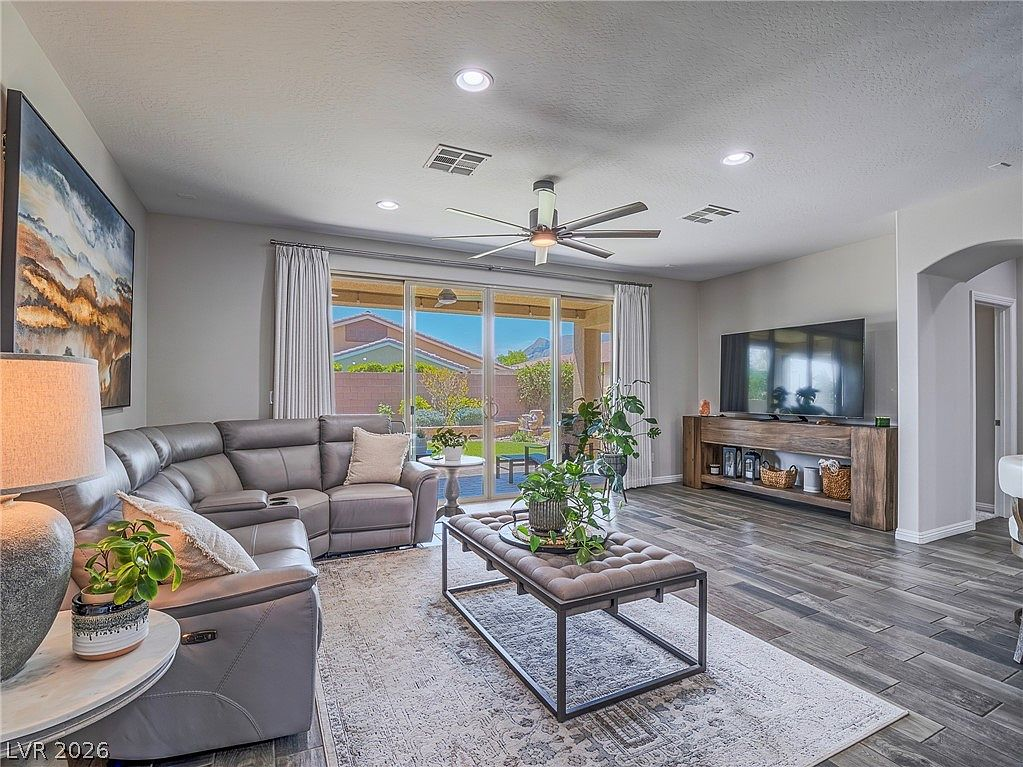 Living room with large sliding glass doors to the backyard