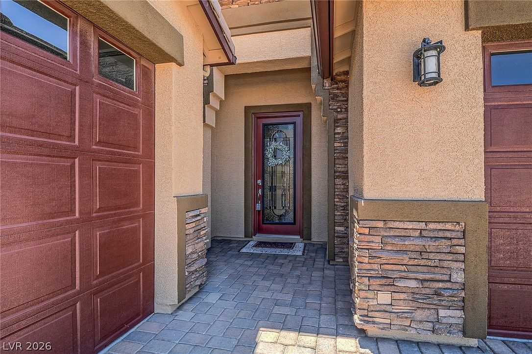 Recessed front entryway with stacked stone accents