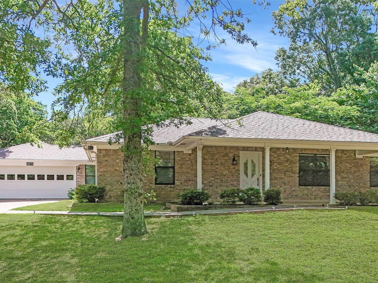 Front exterior view of the ranch-style home from the street