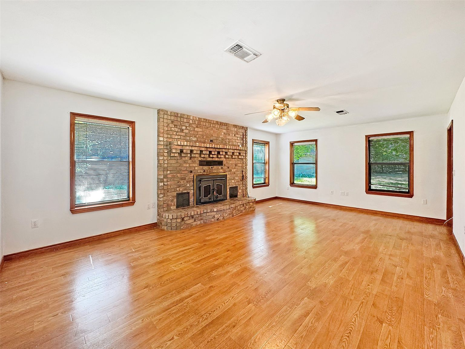 Living room with floor-to-ceiling brick fireplace