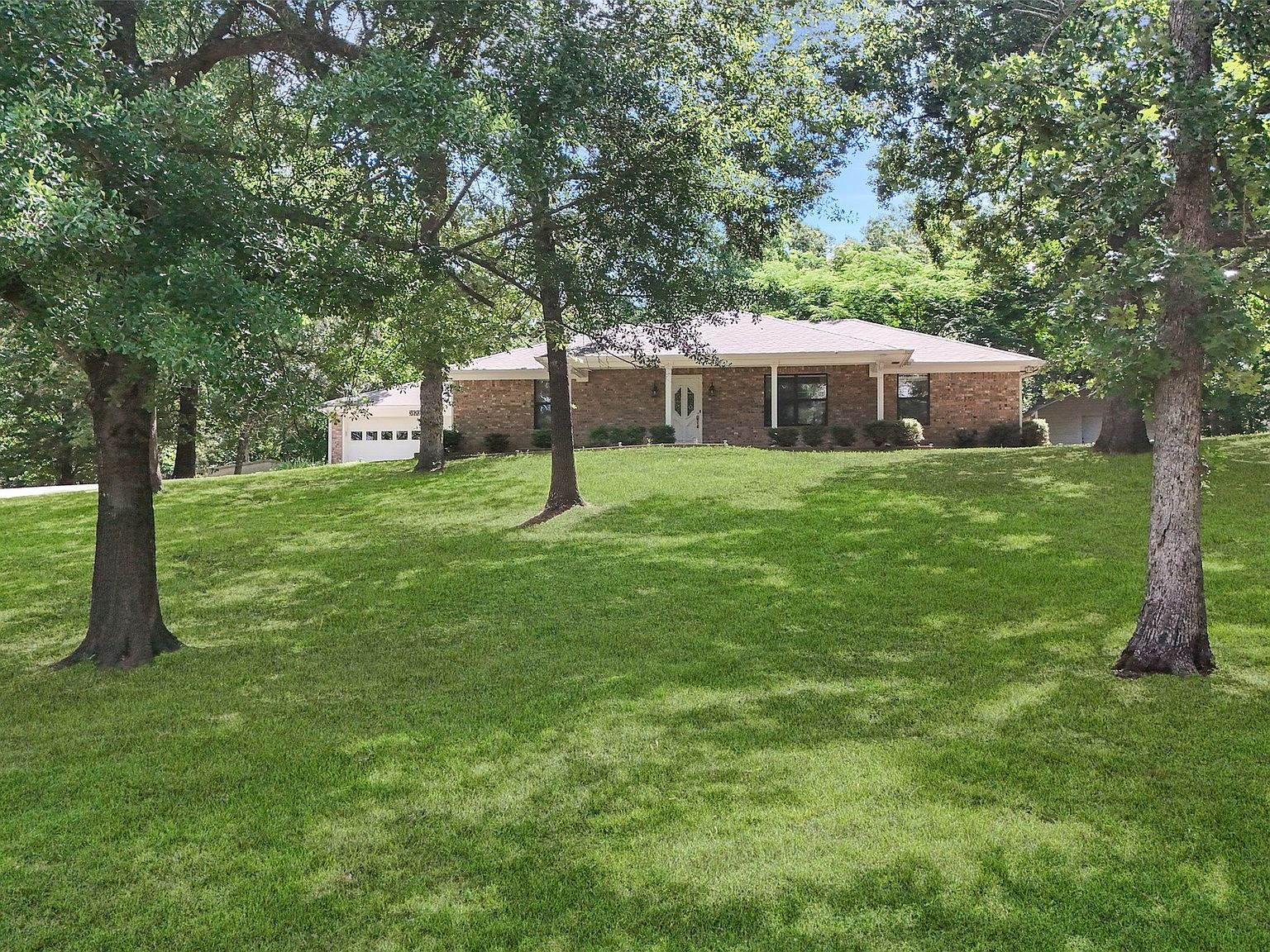 3870 County Road 45080, front exterior view of the ranch-style home from the street