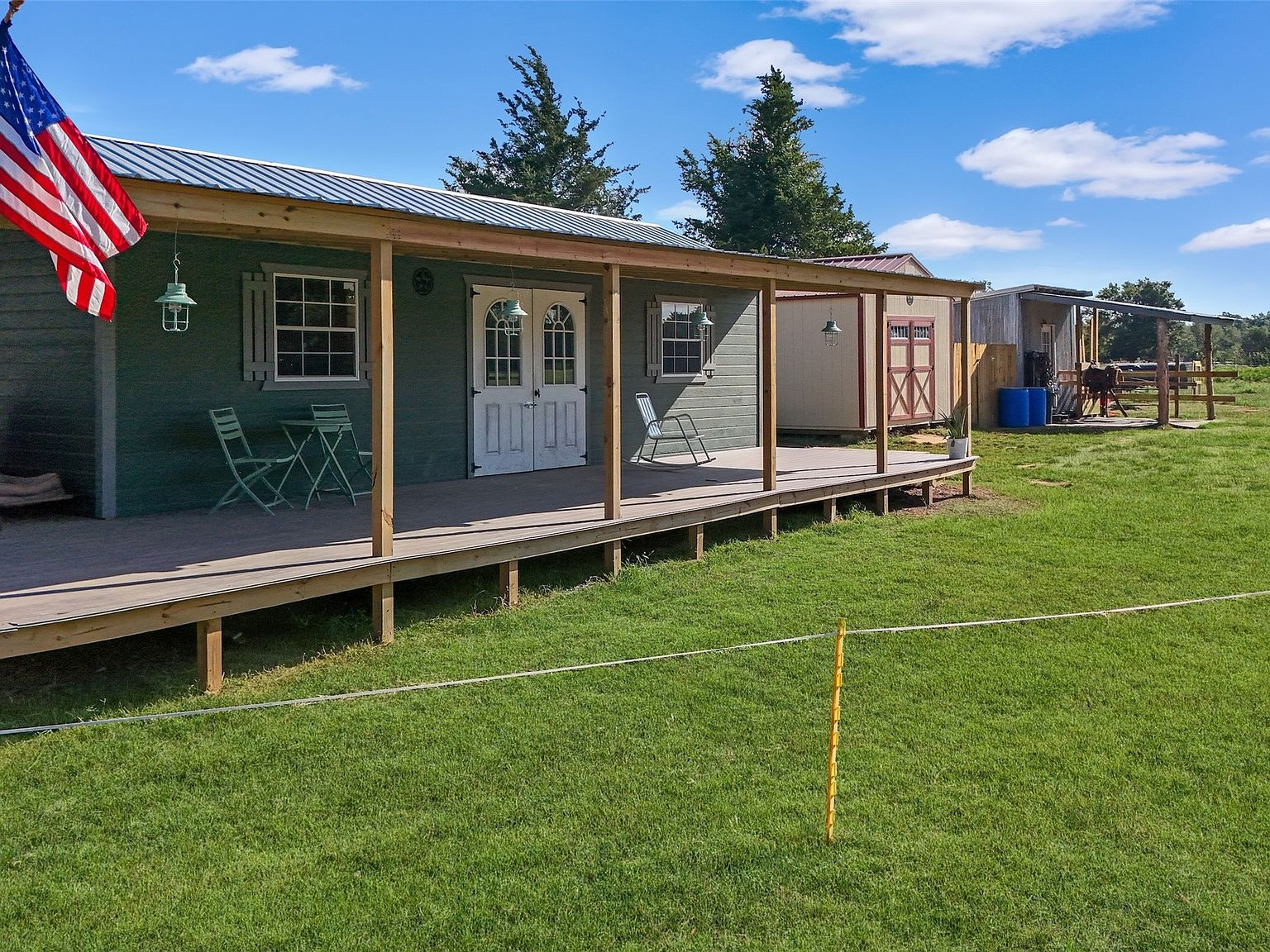 Tiny home exterior with covered porch and metal roof