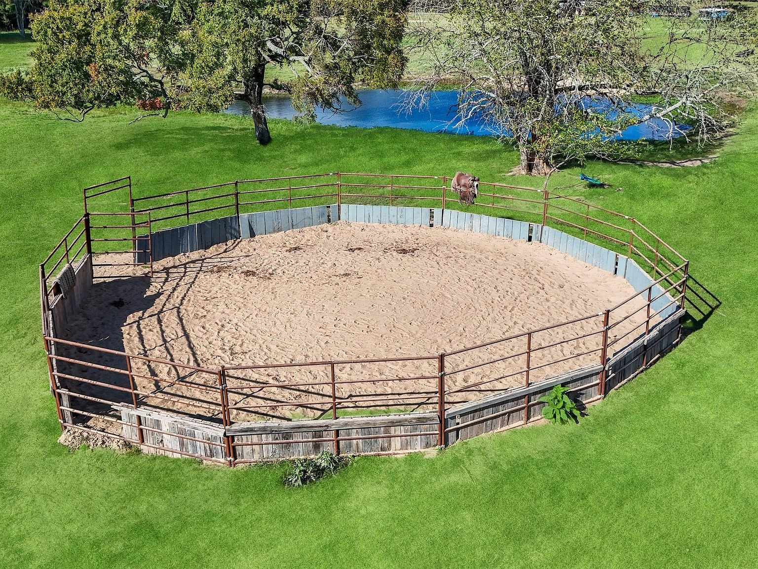 Aerial view of circular horse training round pen
