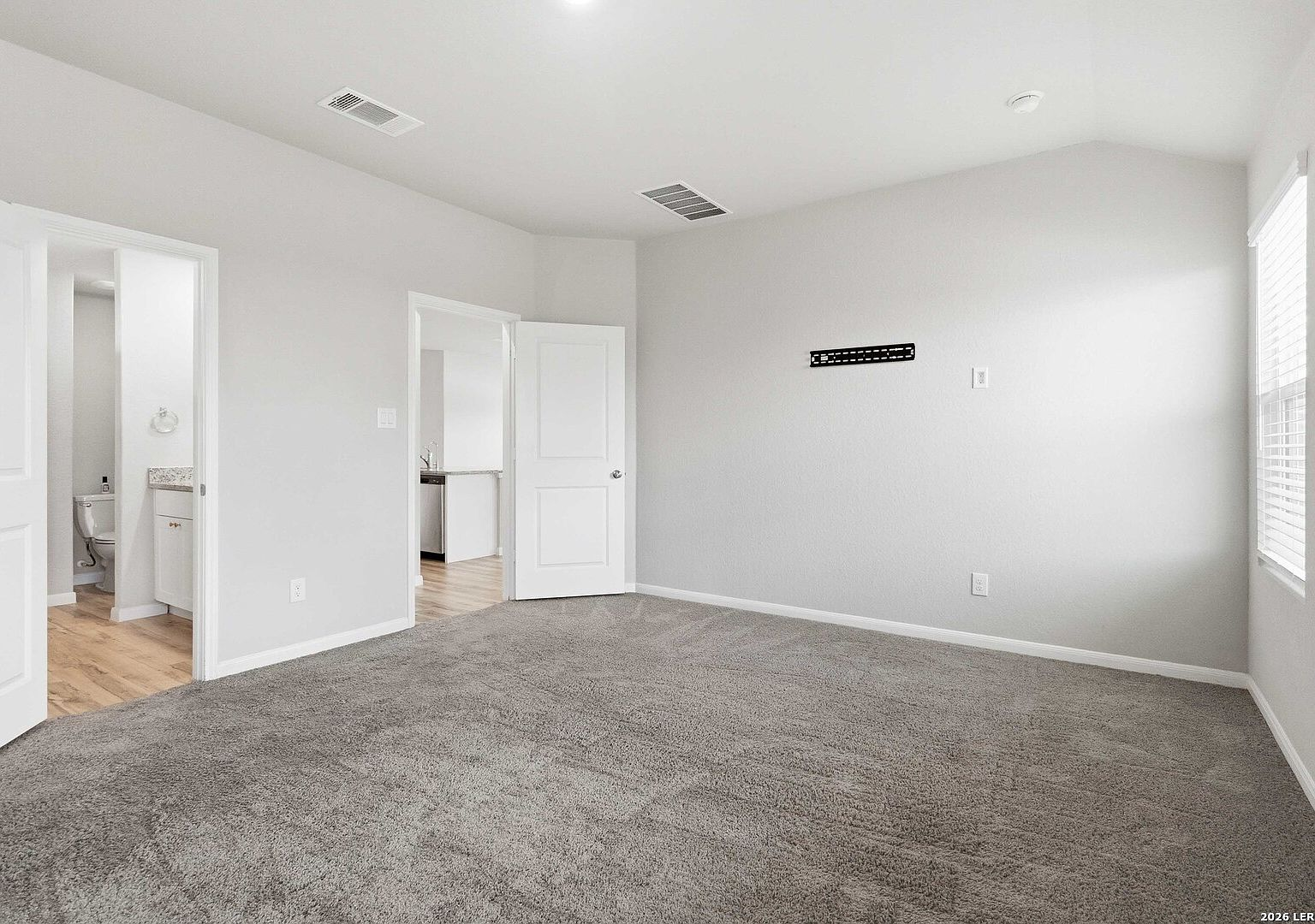 Master suite with ensuite bathroom access and TV wall-mount bracket