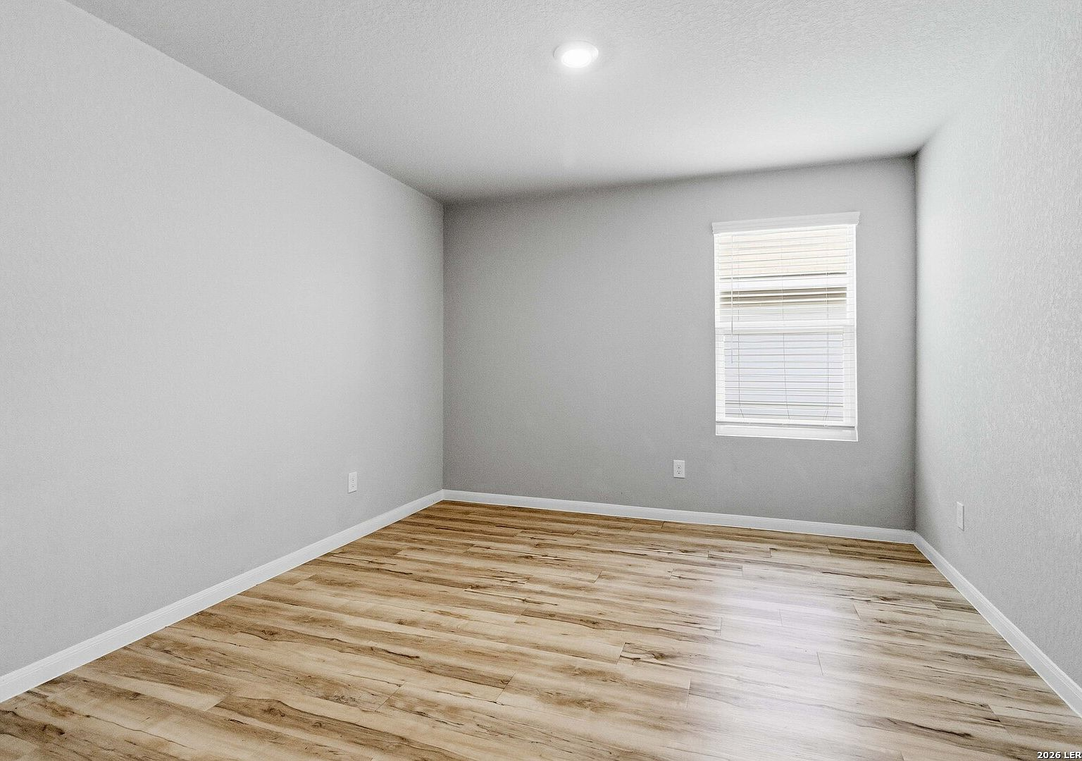 Secondary bedroom with vinyl flooring