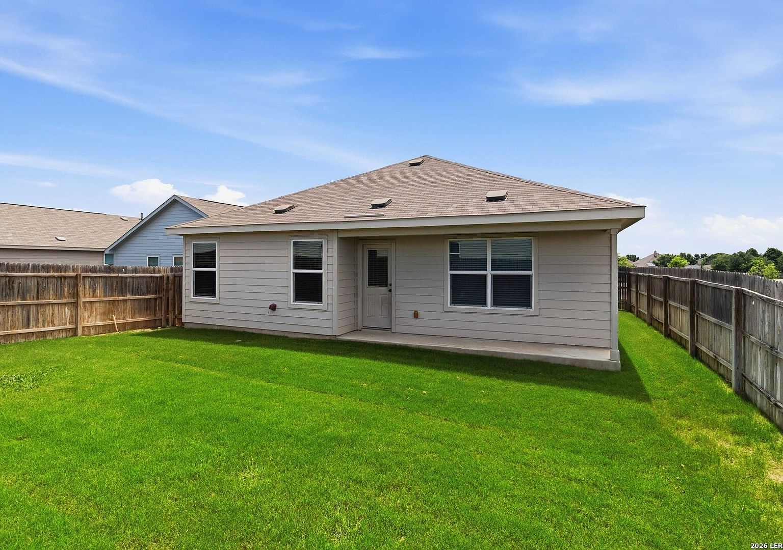 Backyard lawn and privacy fence