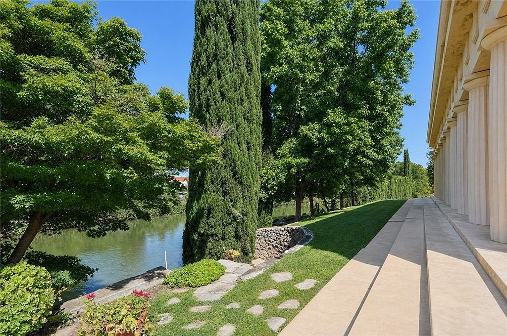 Creekside backyard path along Bear Creek at the Merced property