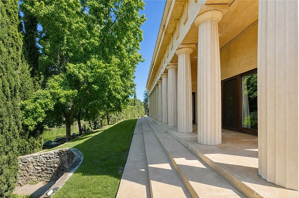Columned patio overlooking Bear Creek at 2021 W St