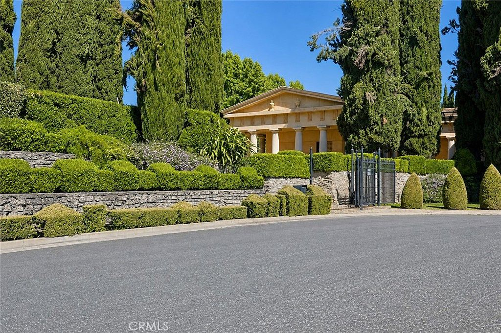 Classical facade with stone walls at the 2021 W St Merced property