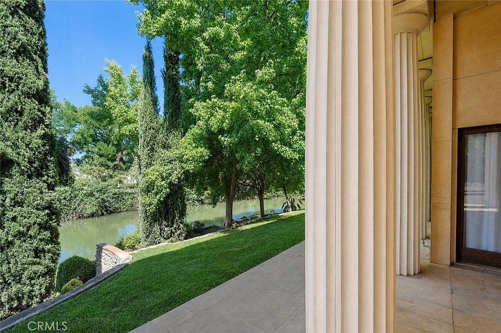 Patio overlooking Bear Creek with classical columns