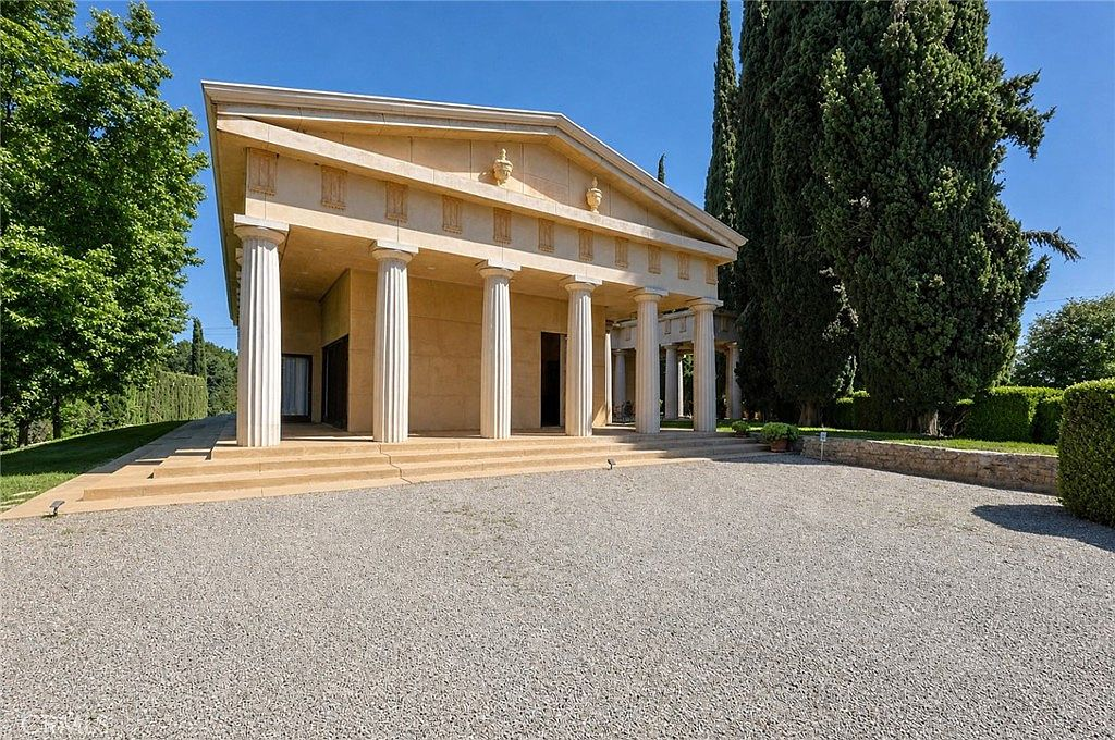 Neoclassical facade with columns at the Merced creekside estate