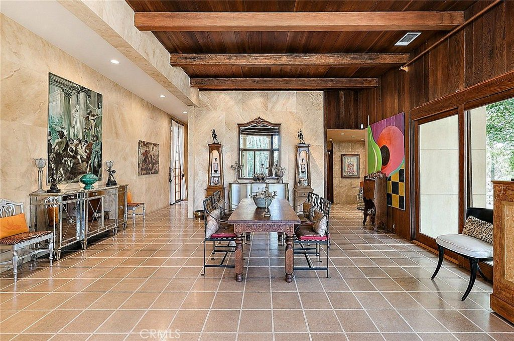 Dining room with exposed wood beam ceilings